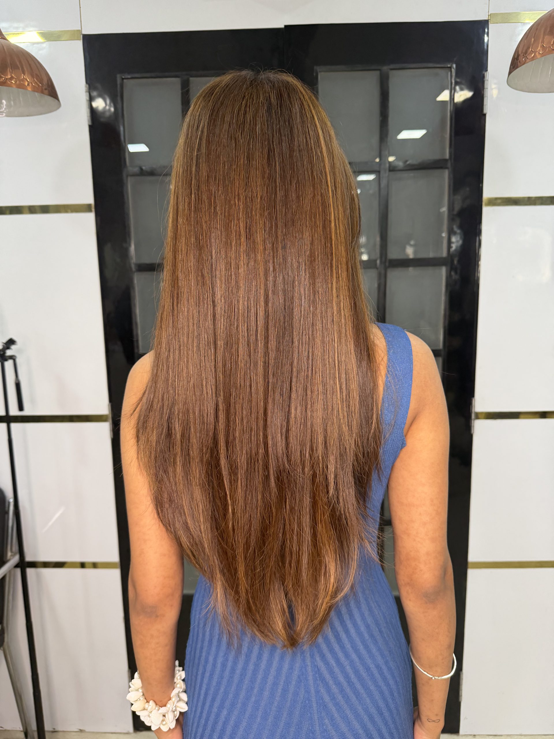 Long smooth shiny hair at Tresses By Nitin