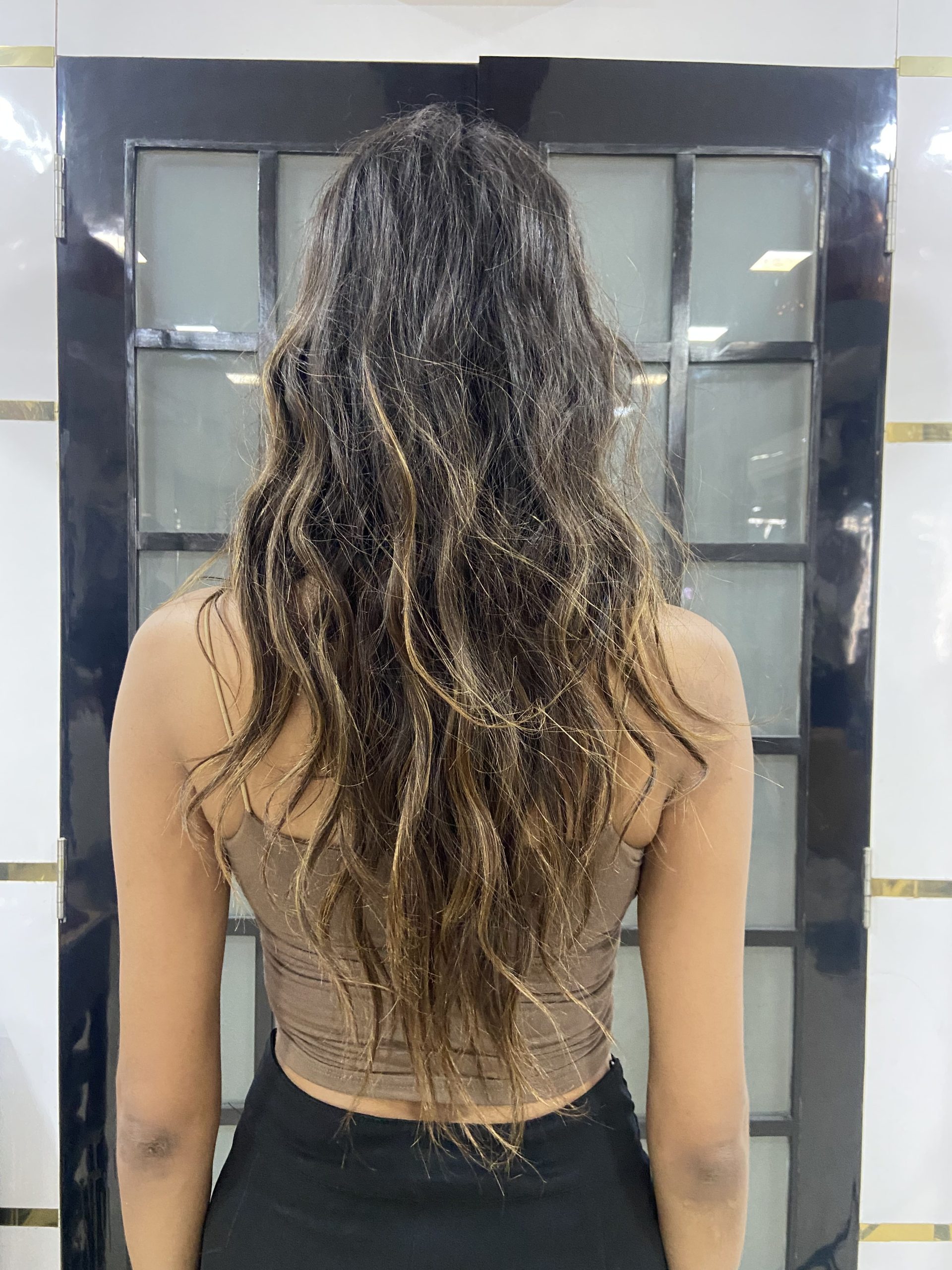 Dimensional highlighted textured hair at Tresses By Nitin